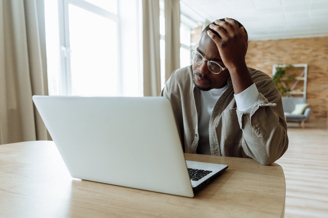 Student hunting for apartments on a laptop